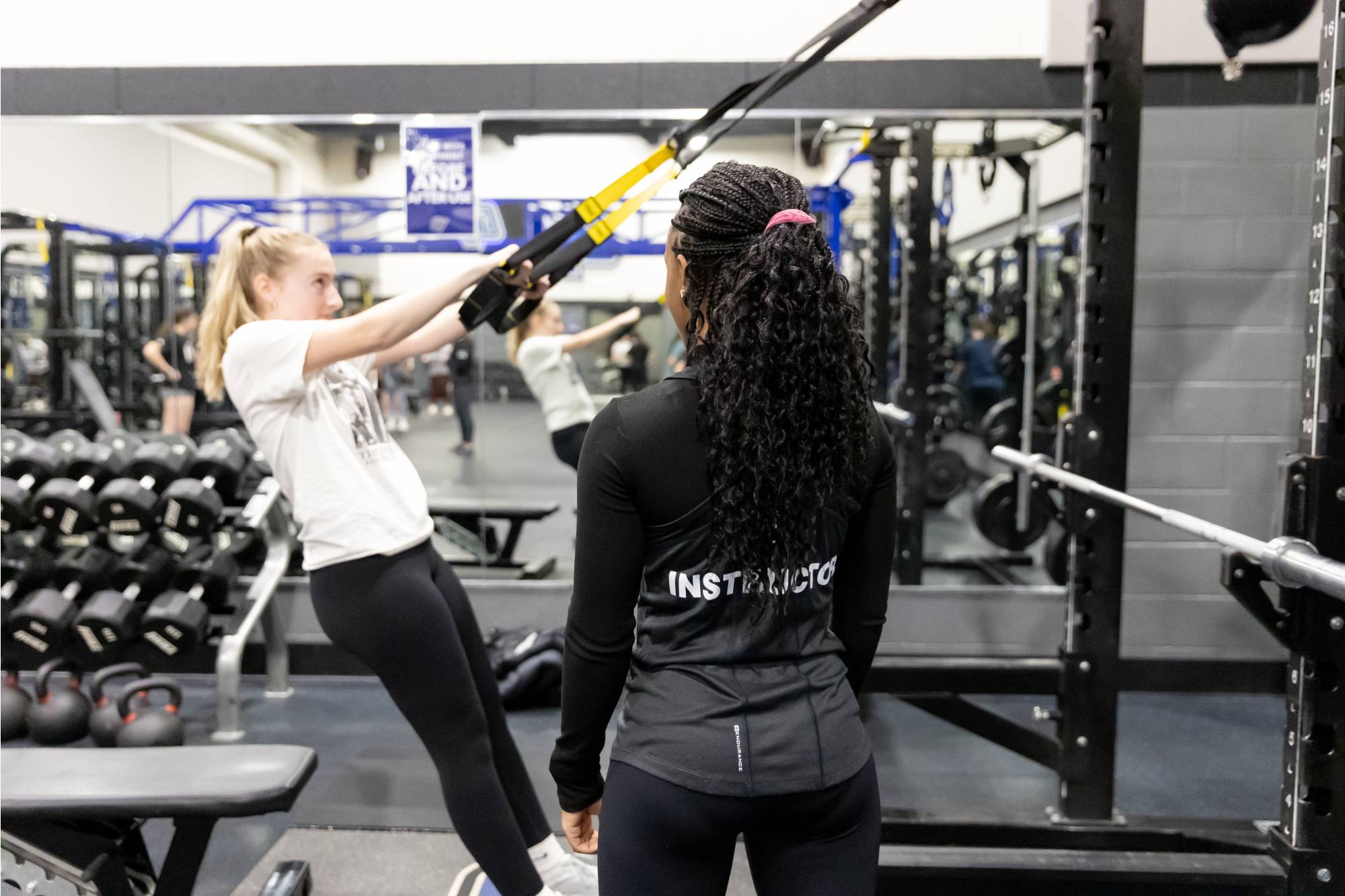 fitness trainer working with a client.